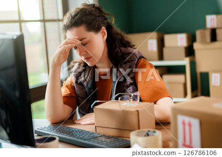 Woman working in a warehouse Woman working in a warehouse 126786106