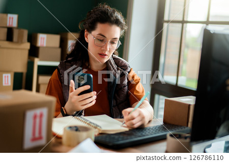 Woman working in a warehouse Woman working in a warehouse 126786110