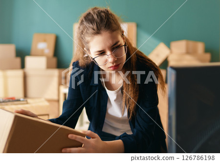 Woman working in a warehouse Woman working in a warehouse 126786198