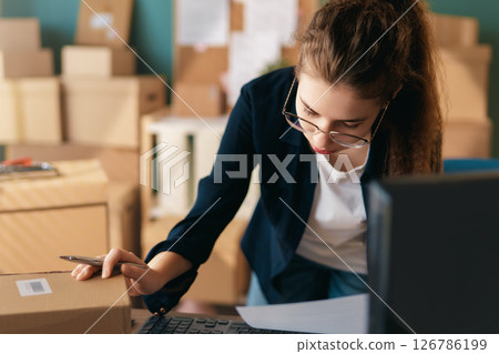 Woman working in a warehouse Woman working in a warehouse 126786199