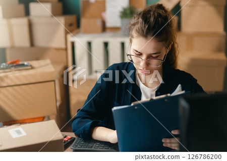 Woman working in a warehouse 126786200