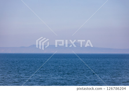 Kunashiri Island in the Northern Territories as seen from Rausu Town Kunashiri Island in the Northern Territories as seen from Rausu Town 126786204