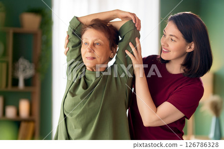 Senior woman doing exercise Senior woman doing exercise 126786328
