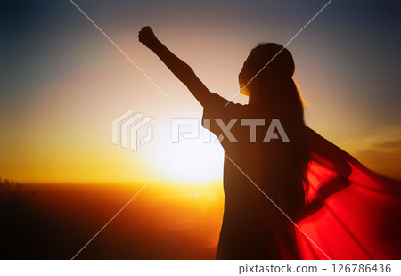 Girl watching sunset Girl watching sunset 126786436