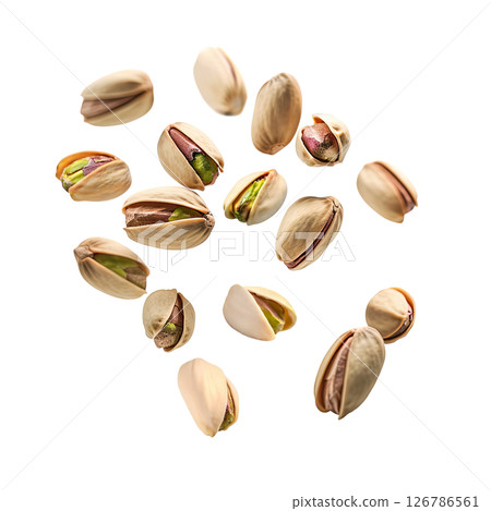 Falling pistachio nuts isolated on a white 126786561