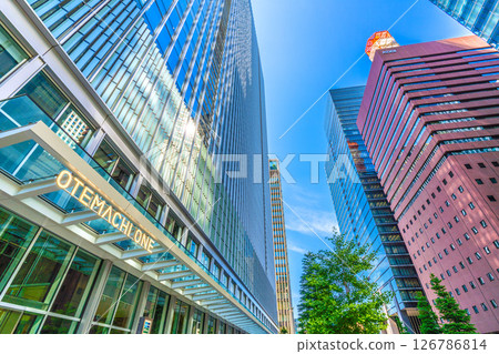Tokyo cityscape in Japan, Otemachi office district.... Looking at Otemachi One reflecting sunlight.... A ray of hope = May 28th 126786814
