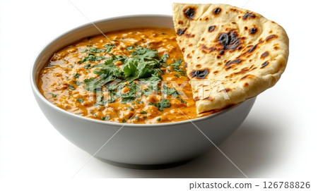 Bowl of Indian Butter Chicken with Naan and Fresh Cilantro Garnish 126788826