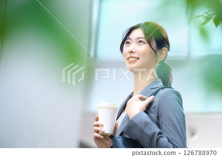 A businesswoman in a suit going to work. Photo courtesy of Sky Perfect TV Tokyo Media Center. 126788970