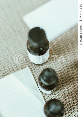 Shot of mature perfumer adding extra essential oil 126789519