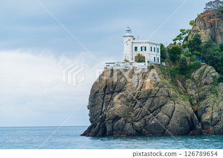 Portofino Lighthouse on Rocky Cliff Above the Mediterranean Sea, Liguria, Italy Portofino Lighthouse on Rocky Cliff Above the Mediterranean Sea, Liguria, Italy 126789654