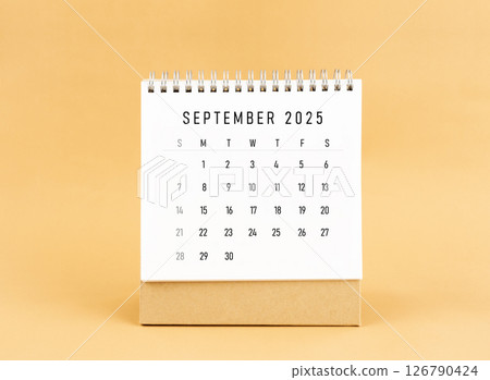September 2025 desk calendar on yellow background, Front view. 126790424