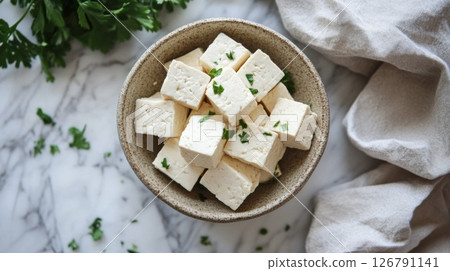 Cubed Tofu in Bowl with Parsley Garnish 126791141