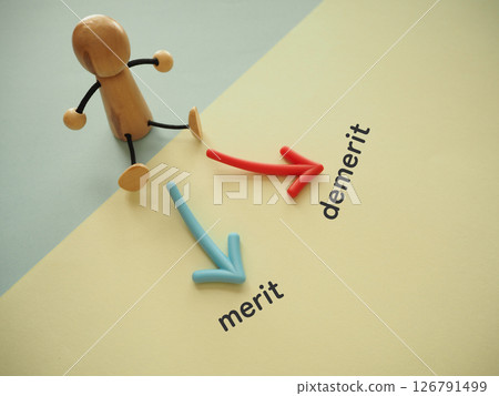 Arrow in front of the doll, merits, demerits, text Arrow in front of the doll, merits, demerits, text 126791499