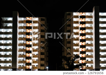Exterior of an apartment building at night 126791656