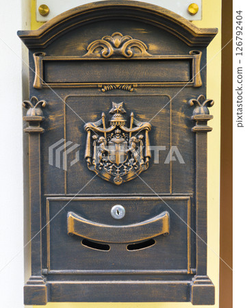 Old vintage mailbox. Post box on the door Old vintage mailbox. Post box on the door 126792404