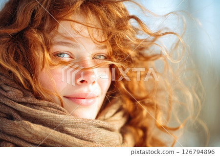 Woman with Red Hair in Windy Winter Light 126794896