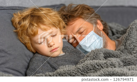 Sick Father and Child Sleeping Together in Bed Sick Father and Child Sleeping Together in Bed 126794971