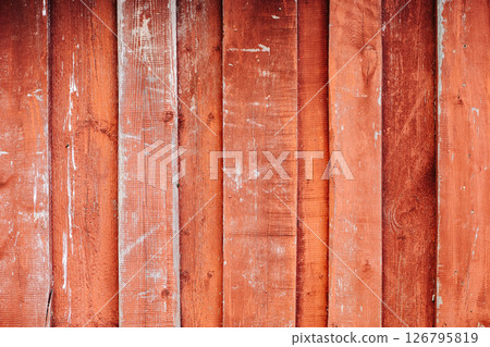 Red weathered wooden planks creating a rustic background 126795819