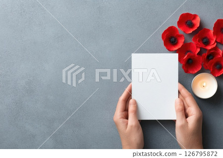 Memorial Card with Red Poppies and Candle on Grey Background Memorial Card with Red Poppies and Candle on Grey Background 126795872