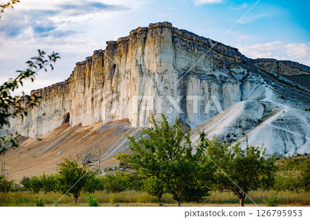 White rock overlooking orchard in Bakhchisaray, Crimea 126795953