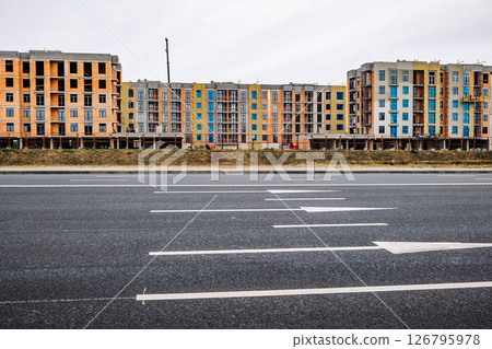 Construction site of new apartment buildings along the highway 126795978