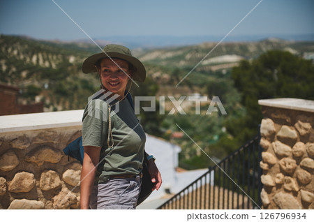 Female Traveler Exploring a Scenic Hilltop Village on a Sunny Day Female Traveler Exploring a Scenic Hilltop Village on a Sunny Day 126796934