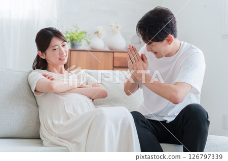 Pregnant wife and husband having a marital dispute Pregnant wife and husband having a marital dispute 126797339