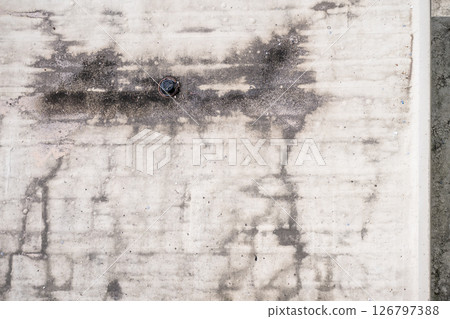 Directly above a white flat roof building drain Directly above a white flat roof building drain 126797388