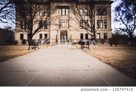 Low angle defocused generic government building entrance with a sidewalk. 126797418