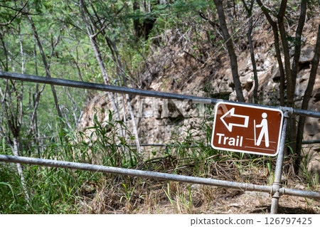 Selective focus on inclined hiking sign along the trail to the summit of Diamond Head State Monument in Oahu, Hawaii  126797425