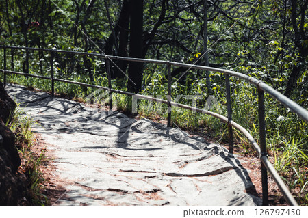 Selective focus on an uneven surface of the hiking trail to the summit of Diamond Head State Monument in Oahu, Hawaii  126797450