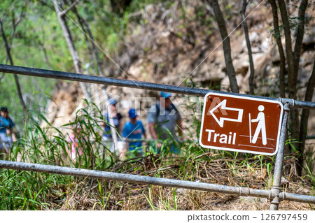 Selective focus on inclined hiking sign along the trail to the summit of Diamond Head State Monument in Oahu, Hawaii Selective focus on inclined hiking sign along the trail to the summit of Diamond Head State Monument in Oahu, Hawaii 126797459