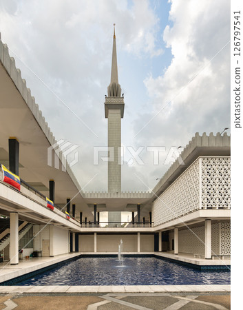 National Mosque of Malaysia, or Masjid Negara, minaret, pool, modern Islamic design. Kuala Lumpur, Malaysia 126797541