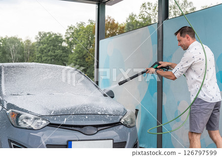 Car wash background. Car washing station foam. Man self service detail splash. Car wash background. Car washing station foam. Man self service detail splash. 126797599
