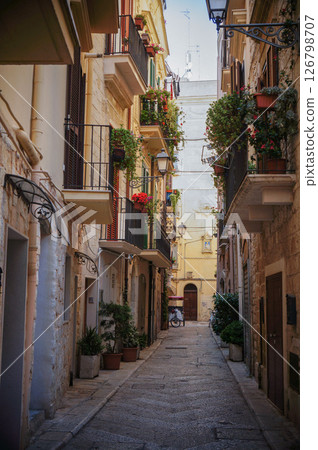 A dark and narrow alley in an Italian city 126798707