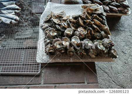 Dried fish grilled on a barbecue Dried fish grilled on a barbecue 126800123