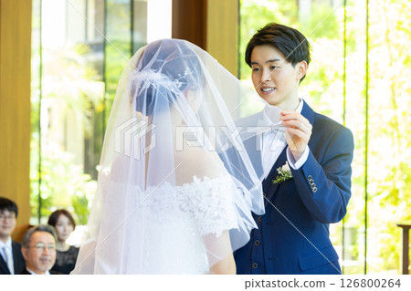 Raising the veil - wedding ceremony 126800264