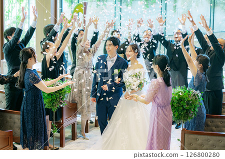Bride and groom exiting flower shower 126800280