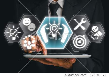 Businessman using a tablet with futuristic icons representing tailored solutions, customization, and strategic planning. 126801172