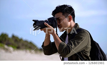 Cameraman taking a video 126801981