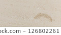 Photo of beige natural marble with abstract pattern, fossils. 126802261