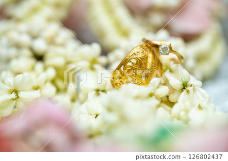 Gold ring , Wedding ring,Diamond ring on the flowers. 126802437