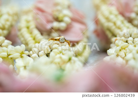 Gold ring , Wedding ring,Diamond ring on the flowers. 126802439