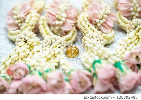 Gold ring , Wedding ring,Diamond ring on the flowers. Gold ring , Wedding ring,Diamond ring on the flowers. 126802485