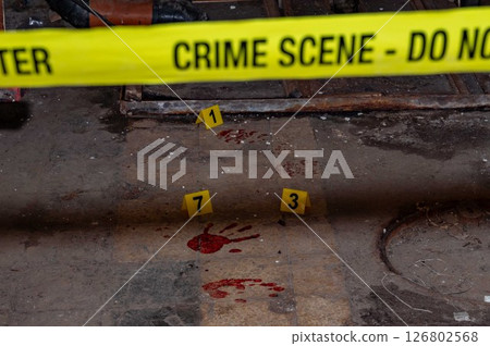 Forensic Crime Scene Investigation with Bloodstains and Numbered Markers. High quality photo Forensic Crime Scene Investigation with Bloodstains and Numbered Markers. High quality photo 126802568