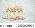 Beautiful Thai-style jasmine garland on a silver cloth background with an ancient Thai pattern. 126802604