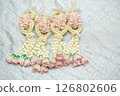 Beautiful Thai-style jasmine garland on a silver cloth background with an ancient Thai pattern. 126802606