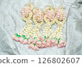 Beautiful Thai-style jasmine garland on a silver cloth background with an ancient Thai pattern. 126802607
