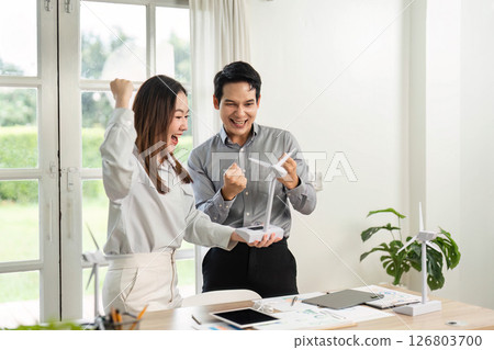 ESG Collaboration Celebration. Excited professionals sharing success in sustainable business. ESG Collaboration Celebration. Excited professionals sharing success in sustainable business. 126803700