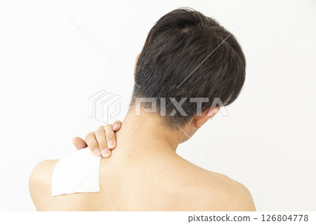 Back view of a man with a compress on white background 126804778